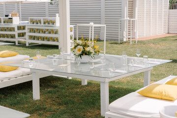 Yellow table setting with lemons and flowers, event, party, wedding decoration, luxury hotel lounge...