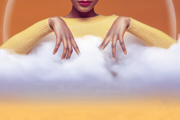 Elegant hands emerging from clouds against a warm orange background