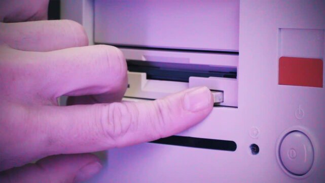 Floppy disc FDD close up, Using diskette for old PC computer macro. Archive programme or Music recorder, playing retro computer games. Vintage device for office, obsolete technology. 