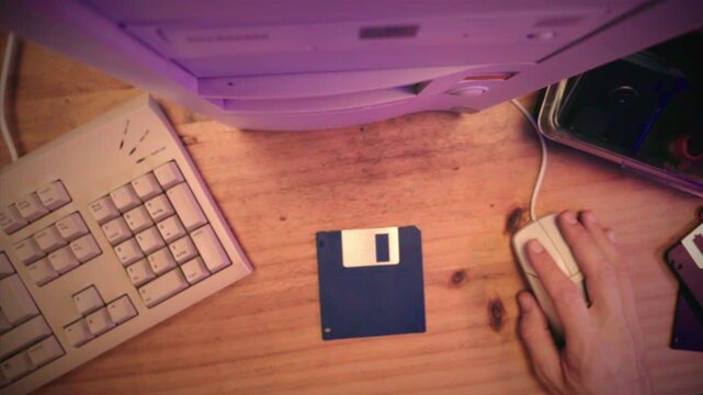 Floppy disc FDD close up, Using diskette for old PC computer macro. Archive programme or Music recorder, playing retro computer games. Vintage device for office, obsolete technology. 