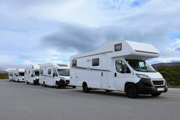 Campers parked on a caravan park. Motorhomes and camping cars for traveling