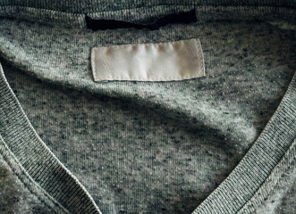 A shirt with a white tag on the back
