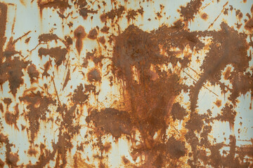 A rusty metal surface with a lot of scratches and marks
