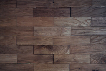 A wooden floor with a brick pattern