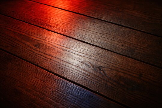 An abstract dance of light and shadow on a wooden canvas