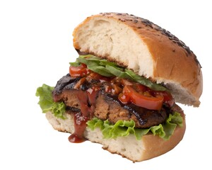 BBQ Portobello Burger cut in half showing juicy grilled mushroom patty with sauce on white background