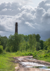 Tall brick tower at cloudy day .
