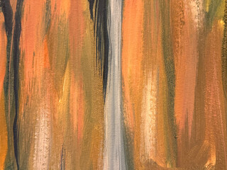 Close up of random brushed paint in orange, brown, grey, and black paint color in vertical pattern....