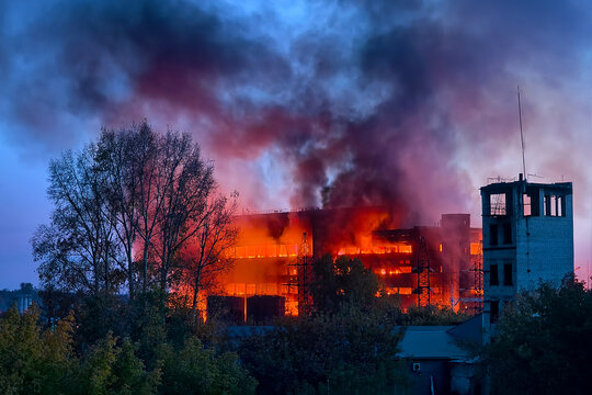 Industrial enterprise fire. smoke against the blue sky.