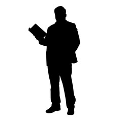 Silhouette of man holding book while standing in formal attire  