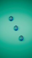 three small blue reflective brains arranged on turquoise background