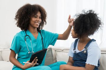 Doctor, patient and health care concept. Female doctor examining kid child girl at hospital
