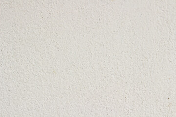 An off-white stucco wall surface featuring a fine, slightly rough texture, ideal as a clean and...