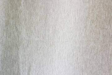 A detailed close-up reveals the subtle, fine vertical texture of a natural, light beige woven fabric, perfect as a minimalist background or organic textile