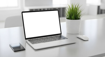 Fototapeta premium Laptop with a blank screen sits on a desk next to a smartphone and potted plant in a bright, minimalist office setting.