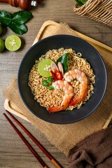 Tom yum kung with noodles , thai style instant spicy noodles with shrimp , noodles tom yum with shrimp