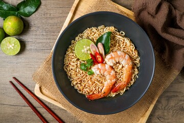 Tom yum kung with noodles , thai style instant spicy noodles with shrimp , noodles tom yum with shrimp