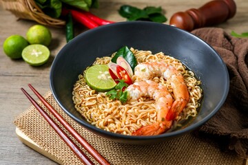 Tom yum kung with noodles , thai style instant spicy noodles with shrimp , noodles tom yum with shrimp