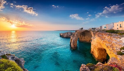fantastic summer sunrise on popular tourist attraction torre sant andrea wonderful morning seascape of adriatic sea torre sant andrea village location apulia region italy europe