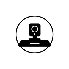 An isolated silhouette illustrates a webcam icon with its base and lens depicted clearly in a rounded box on a transparent background.