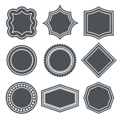 A digital illustration featuring a collection of nine different blank, dark gray shapes or frames, each with a white outline. The shapes vary in complexity, including ornate curves, pointed edges.