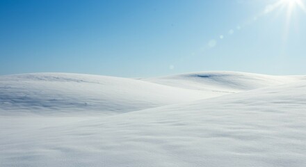 Obraz premium Snowy Hills Under Bright Sunlight on a Clear Day
