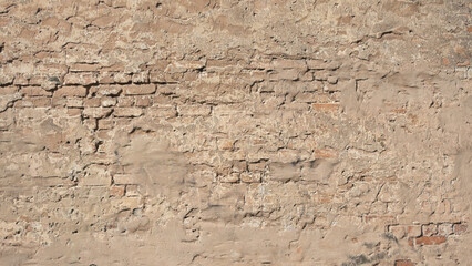brown background, in the photo an old brick wall and old plaster