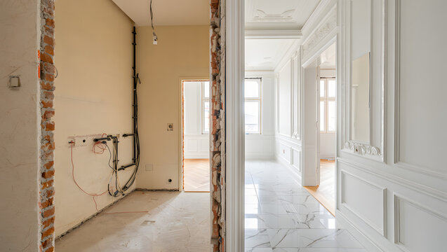 Fototapeta Split view of an apartment undergoing renovation contrasting old exposed brick with new elegant white paneling