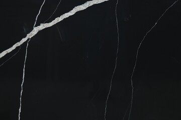 Texture of black marble surface as background, top view