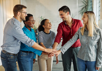 Portrait of a smart young businesspeople during meeting in the office or classroom. Teamwork,...