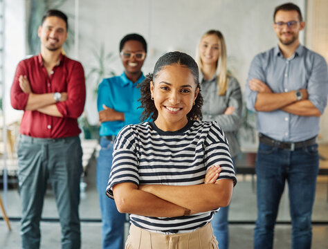 Portrait of a group of young business people having a meeting in the office. Teamwork and success concept, portrait of a smart young businesswoman