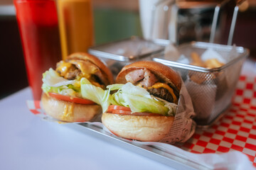 Classic Diner Cheeseburgers with Fries and Drinks