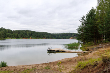 Peaceful Forest Lake with Wooden Dock