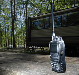 Help signal on a walkie talkie in a campsite