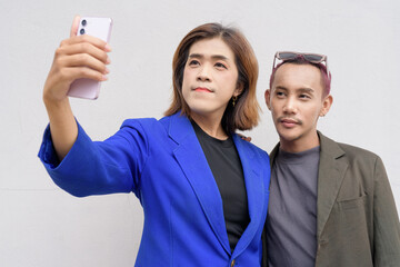 Gender inclusive business team couple against white background