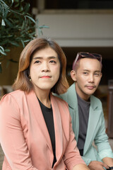 Transgender and non-binary coworkers working remotely in cafe