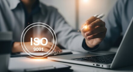 Fototapeta premium A team is working on iso 9001 certification, demonstrating a commitment to quality management systems and process improvement