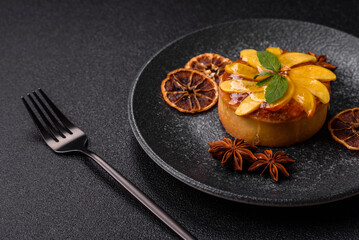 Sweet round pie or tart with apples and peach. Mini sweet tart