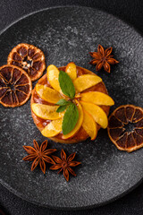 Sweet round pie or tart with apples and peach. Mini sweet tart