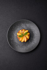 Sweet round pie or tart with apples and peach. Mini sweet tart