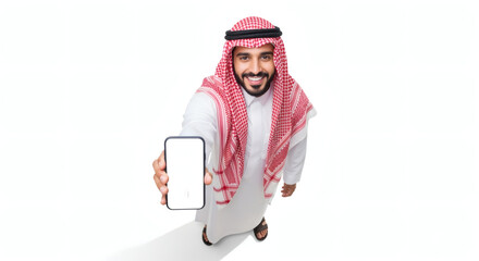 Saudi man in traditional attire holding blank smartphone, white background, studio shot.