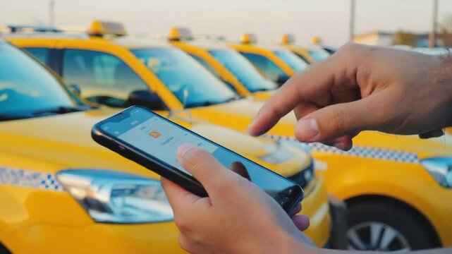 Ordering a taxi in the city with a taxi app.