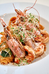 Gourmet seafood pasta with shrimp and sprouts
