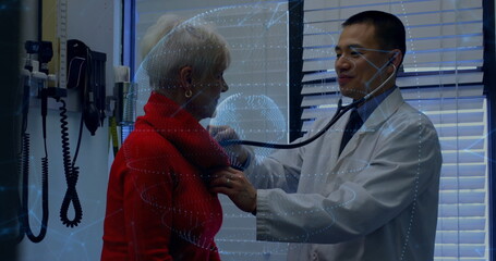 Listening doctor using stethoscope on patient chest in exam room, BP monitor blinds data overlay