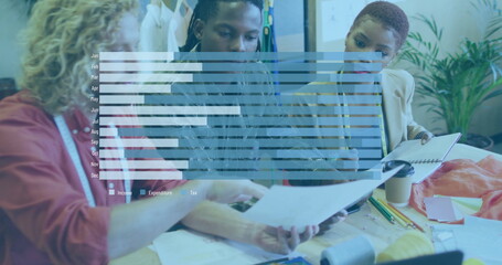 Collaborating three fashion designers sketching patterns in design studio, with color swatches