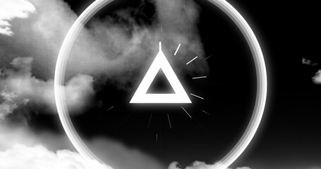 Floating equilateral triangle casting glow amid swirling clouds, with halo radiating light rays