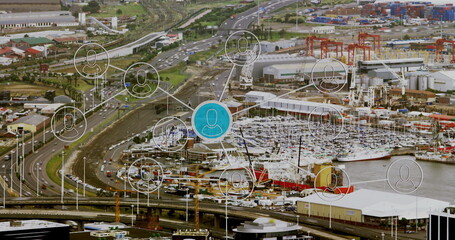 Displaying central blue network node connecting containers, cranes and ships at industrial port