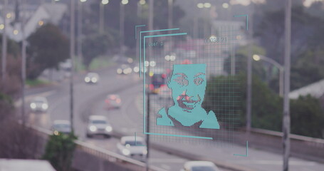Projecting turquoise interface over urban highway, with recognition grid and vehicles