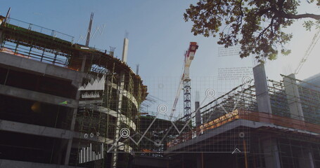 Showing tower crane and scaffolded concrete structure with rebar at job site, with digital overlays