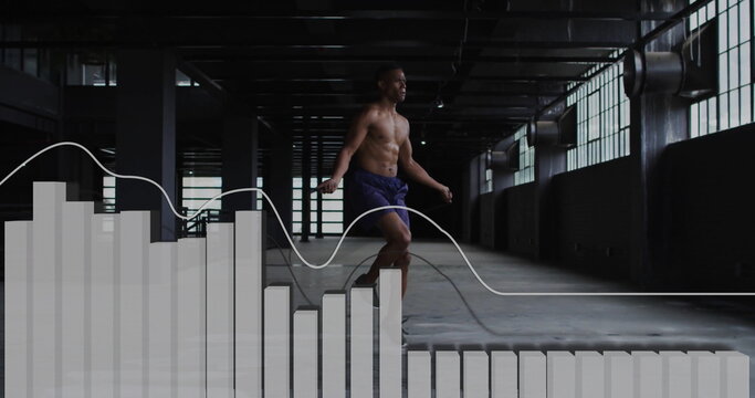 Shirtless man skipping rope in shorts at warehouse gym, with bar chart and line graph overlay